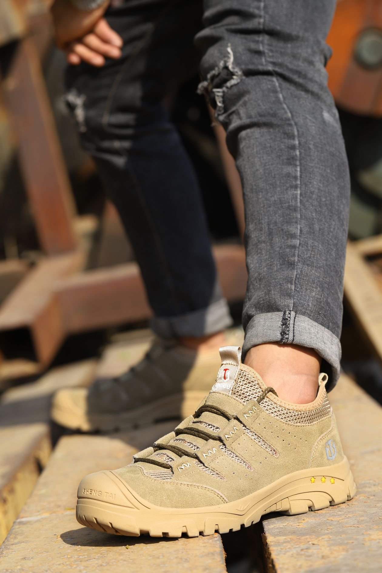 Brown lace-up shoes styled with black denim jeans for an everyday casual outfit